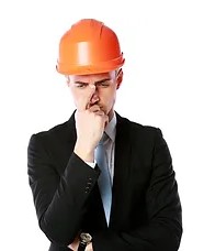 A man wearing a business suit and a hard hat.